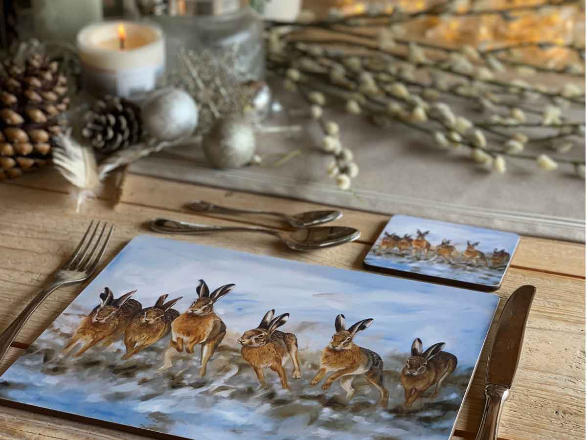 table set with hare placemat and coaster baubles and branches
