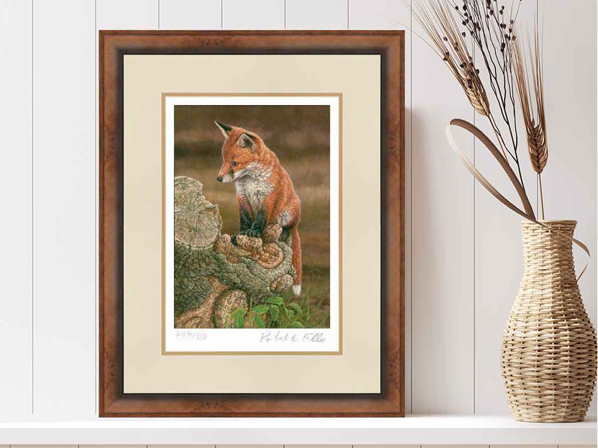 framed print of fox on tree stump with wicker vase and dried flower arrangement
