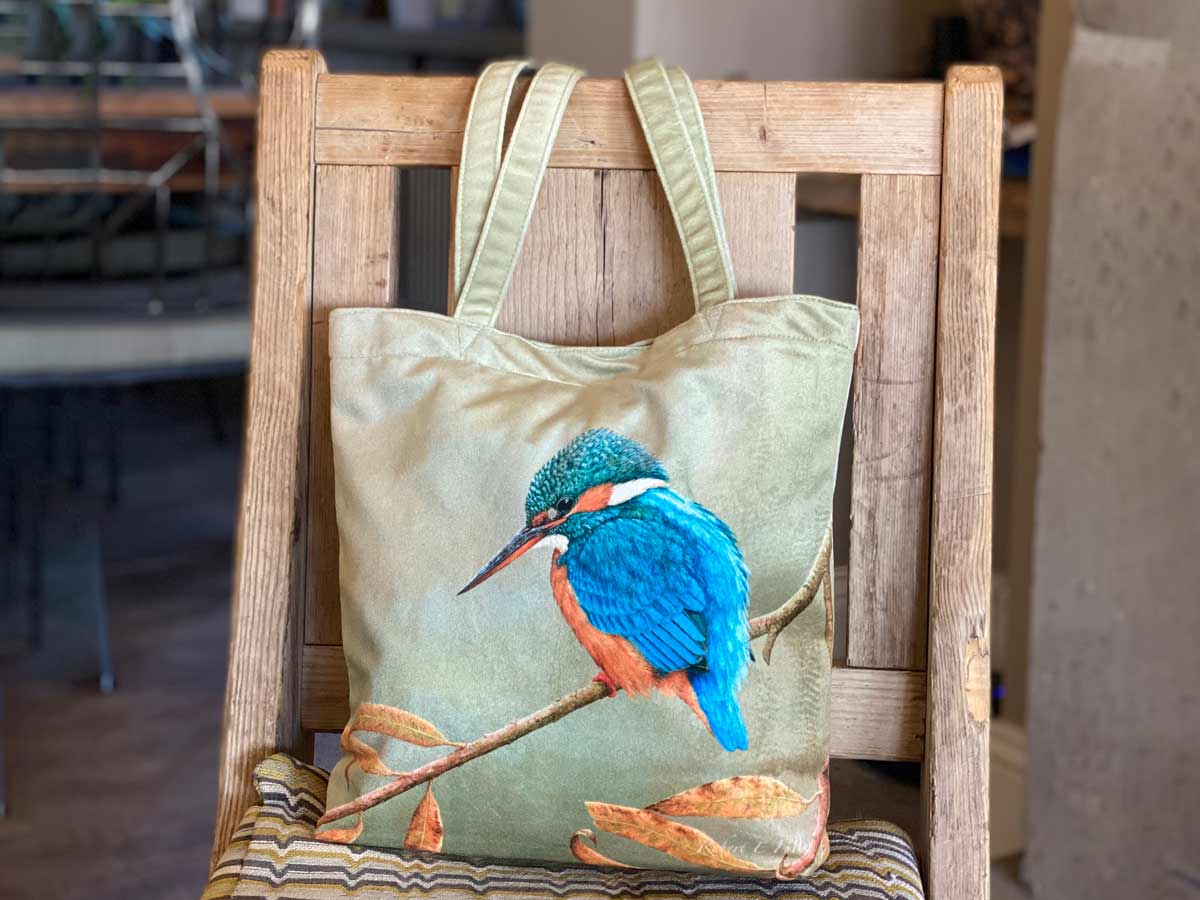 tote bag featuring blue kingfisher on chair