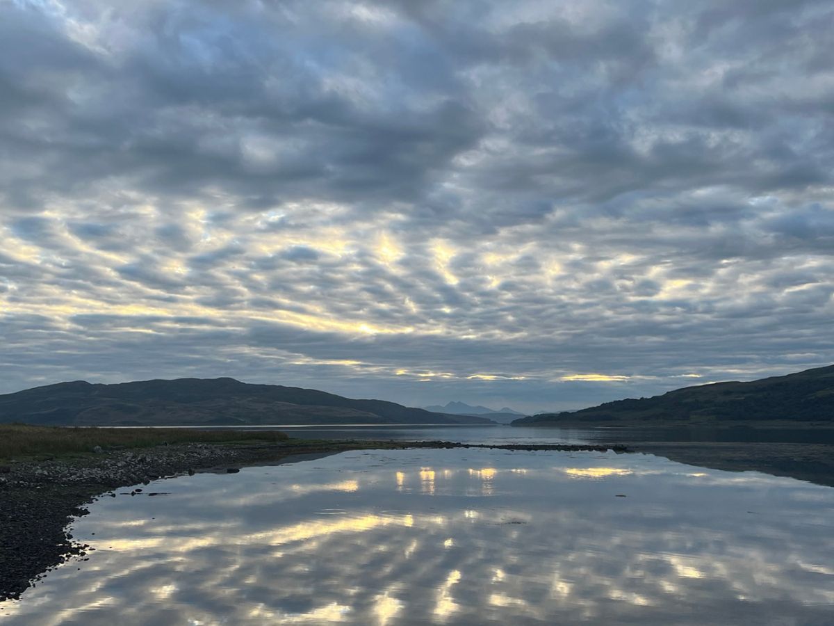 clouds reflected in loch on isle of mull scotland