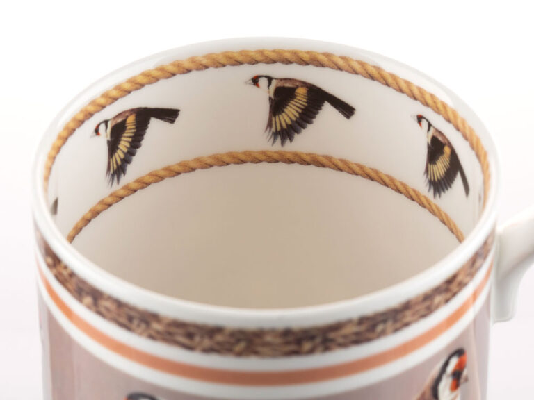 Inside rim of Goldfinch coffee cup by Robert E Fuller