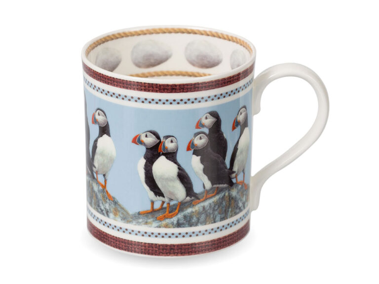A fine bone china mug featuring Puffins by wildlife artist Robert E Fuller