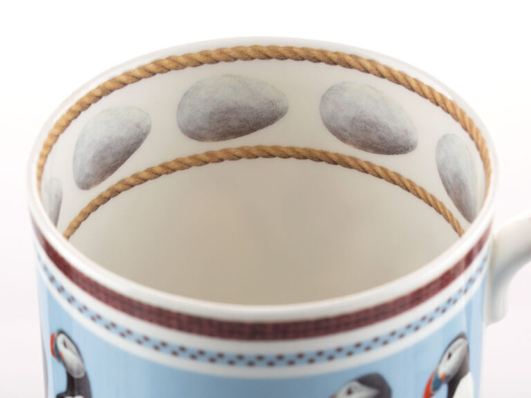 Inside rim of Puffin coffee cup by Robert E Fuller